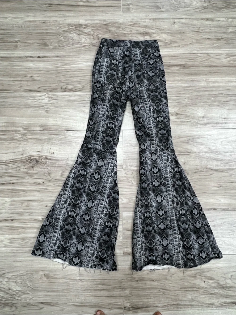 We The Free Free People Just Float On Snake Print Flare Bell Bottom Jeans